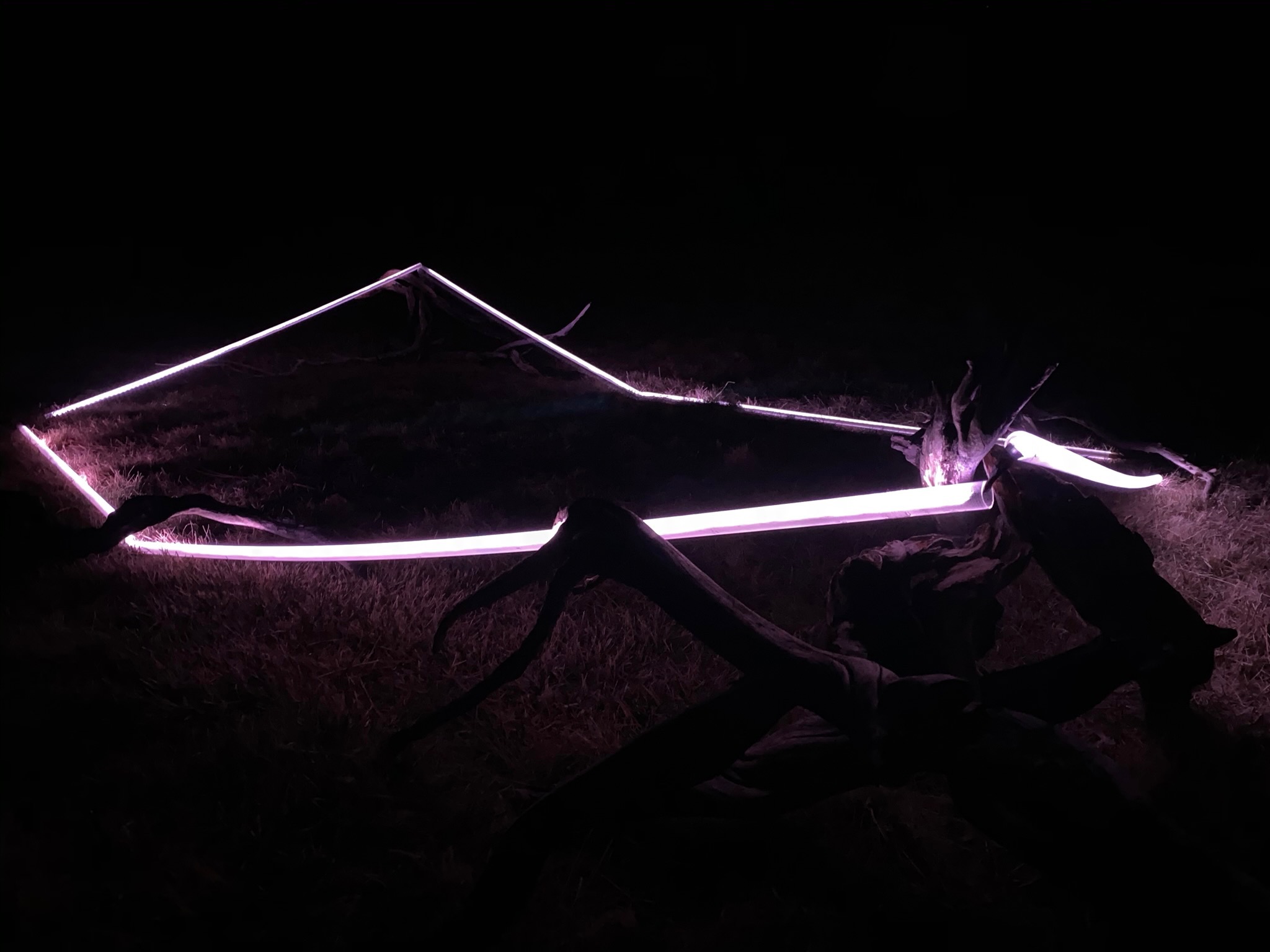 strips of white lights in the dark of night