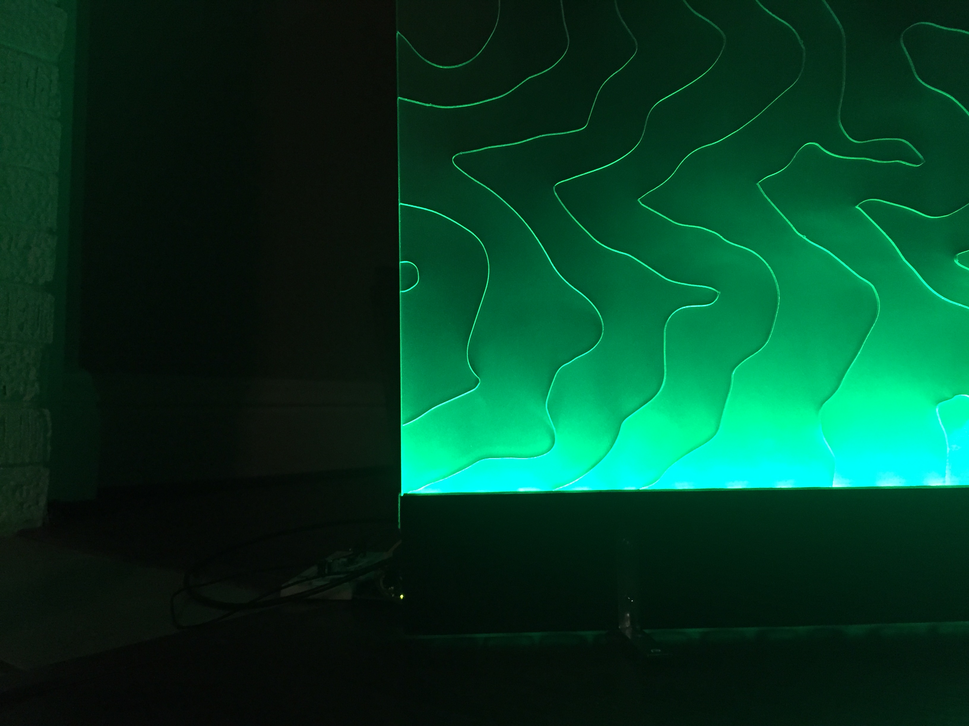 closeup of green lit topographic lines